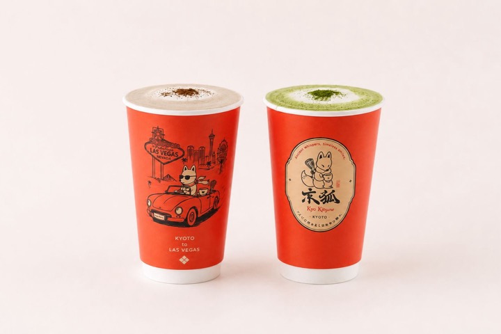 Two hot Kyo Kitsune cups side by side, one printed with a fox driving past Las Vegas landmarks and one with the fox emblem